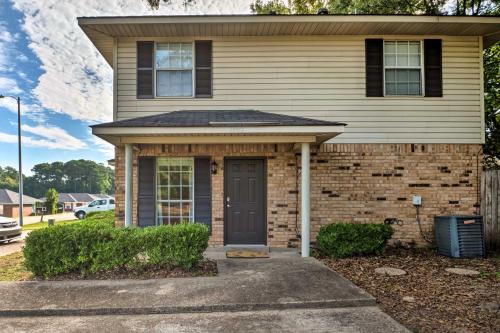 a brick house with a black door at Cozy Ruston Townhome Less Than 1 Mi to Louisiana Tech in Ruston