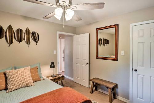 a bedroom with a bed and a ceiling fan at Cozy Ruston Townhome Less Than 1 Mi to Louisiana Tech in Ruston