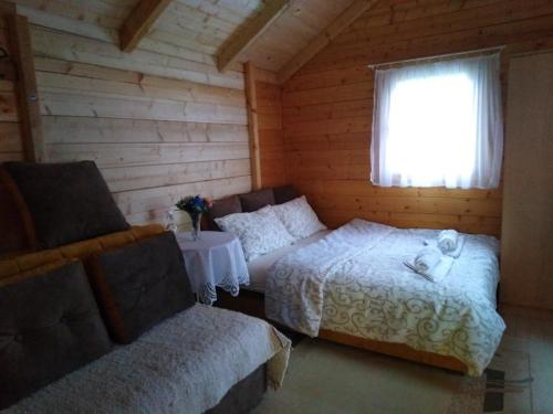 Postel nebo postele na pokoji v ubytování Vikendica Mijajlović 2