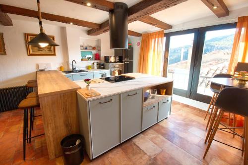 a kitchen with a sink and a counter top at Cuencaloft La Casa Del Pintor in Cuenca
