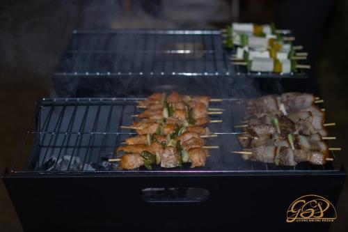 a grill with several types of food on it at Yalamul Garden in Pātan