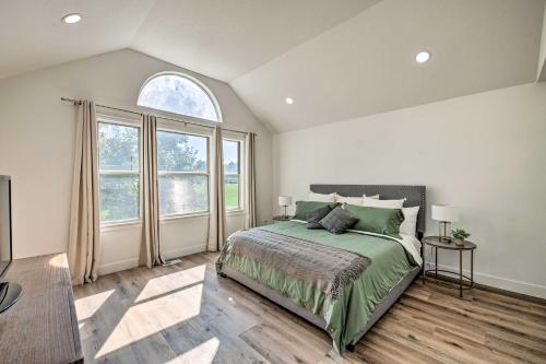 a bedroom with a bed and a large window at Cottonwood Heights Townhome Near Ski Resort! in Cottonwood Heights