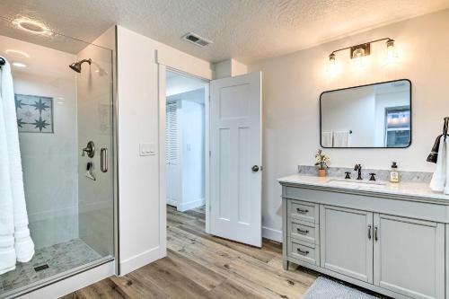 a bathroom with a shower and a sink and a mirror at Cottonwood Heights Townhome Near Ski Resort! in Cottonwood Heights
