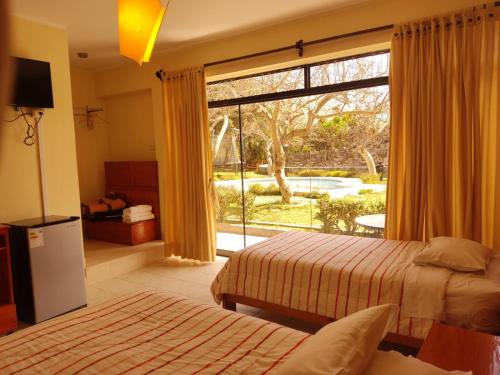 Ένα ή περισσότερα κρεβάτια σε δωμάτιο στο Hotel Rumi Wasi
