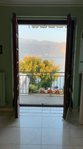 an open door to a balcony with a view at Residenza Le Magnolie in Verbania