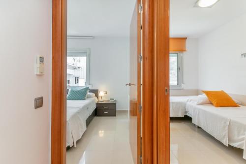 Postel nebo postele na pokoji v ubytování Fragata Sitges Rentals