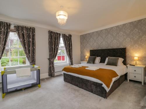 Una cama o camas en una habitación de The Manor House