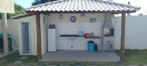 a small kitchen with a counter in a building at Dream House in Itacimirim