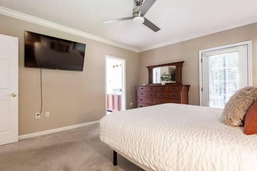 a bedroom with a bed and a flat screen tv at Family Fun Getaway near Cascade Lake in Warwick NY in Warwick