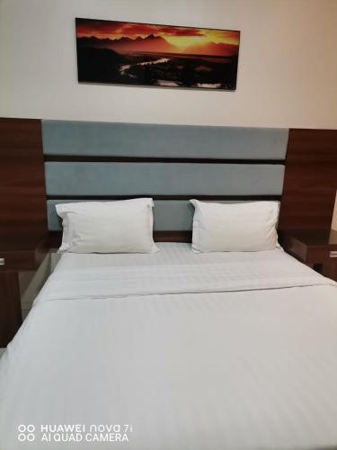 Кровать или кровати в номере Al Massah Al Khalijiyah Furnished Units