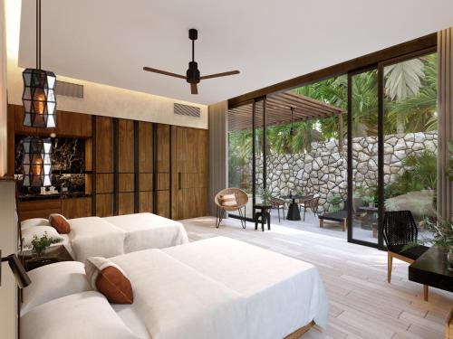 a living room with white furniture and large windows at Hacienda Xcanatun, Angsana Heritage Collection in Mérida