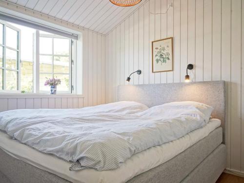 Lova arba lovos apgyvendinimo įstaigoje Holiday home Rønne XI