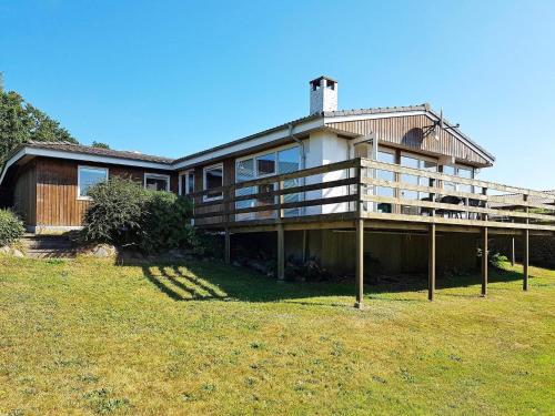 a large house on a hill with a grass field at Seaside Serenity at Hvidbjerg-By Traum in Børkop