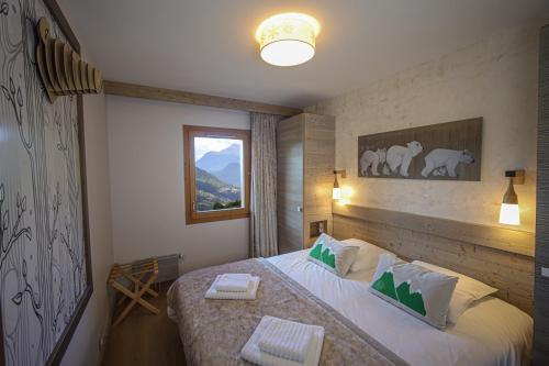 Letto o letti in una camera di Résidence l'Hévana - Appartements de Prestige Méribel Centre