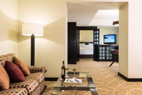 a living room with a couch and a table at Hotel Marquis Reforma in Mexico City