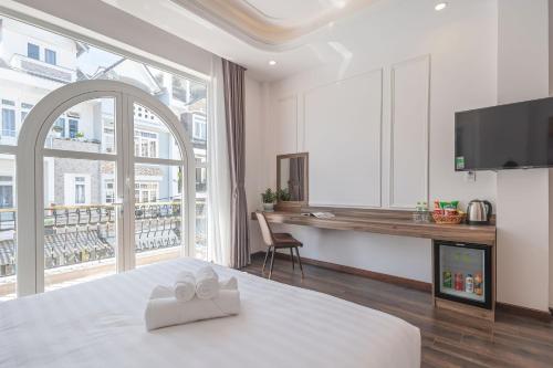 Postel nebo postele na pokoji v ubytování MSing DaLat Hotel