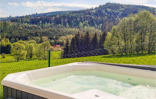 a bath tub with a view of a mountain at Beautiful Home In Rajcza With Kitchenette in Rajcza