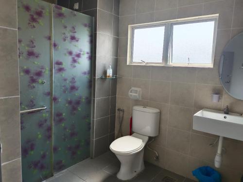 a bathroom with a toilet and a shower and a sink at DG HomestayMuslim Putrajaya - Near Alamanda in Putrajaya