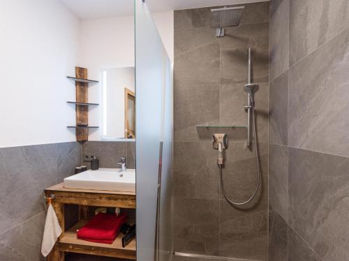 a bathroom with a shower and a sink at Haus Hüttenberger in Going am Wilden Kaiser