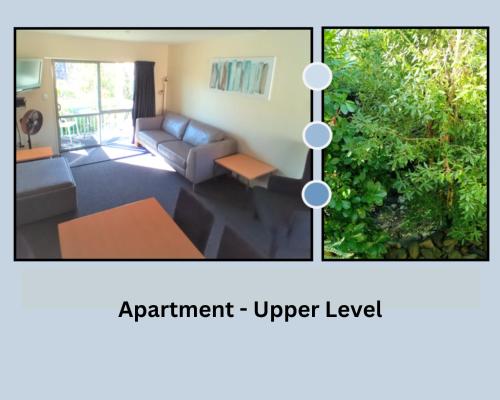 a living room with a couch and a table at La Rochelle Motel in Akaroa