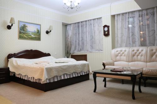 Postel nebo postele na pokoji v ubytování Hotel Botakoz