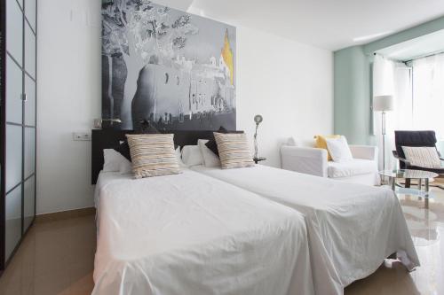 Ένα ή περισσότερα κρεβάτια σε δωμάτιο στο Apartamentos Edificio Constitución