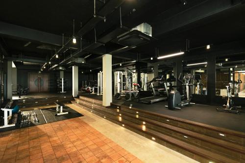 a gym with a treadmill and exercise equipment in it at Club Hotel Dolphin in Negombo