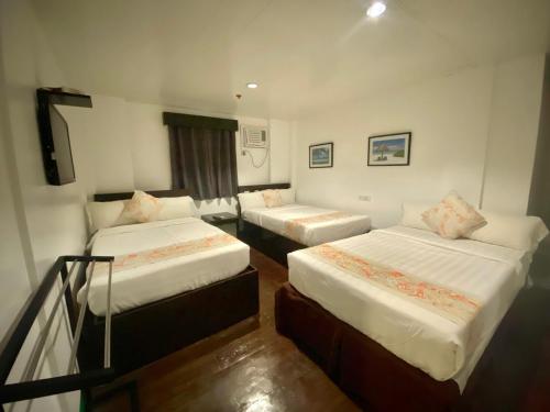 Postel nebo postele na pokoji v ubytování Emerald Bay Boracay