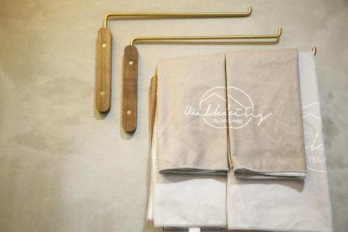 a table with two napkins and two wooden utensils at Walking Island in Xiaoliuqiu
