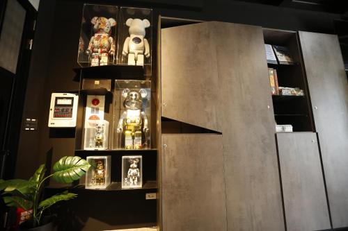 a cabinet filled with lots of figurines on display at Walking Island in Xiaoliuqiu