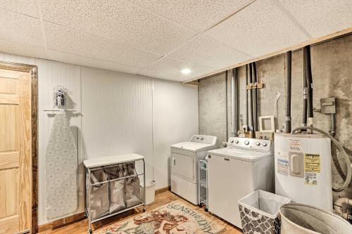 a laundry room with a washer and dryer at Ellijay Resort Cabin with Deck and Enclosed Porch! in Ellijay