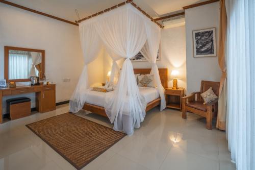 Postel nebo postele na pokoji v ubytování Budhi Ayu Villas and Cottages Ubud by Mahaputra-CHSE Certified