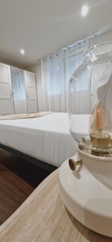 a bedroom with a bed and a bowl on a table at Hotel El Panorama in Tapia de Casariego