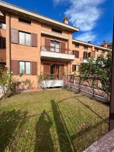 a large building with a yard in front of it at Casa Gianfranco in Gubbio