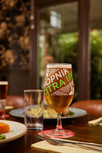 a glass of beer sitting on top of a table at The Ribchester Arms in Blackburn