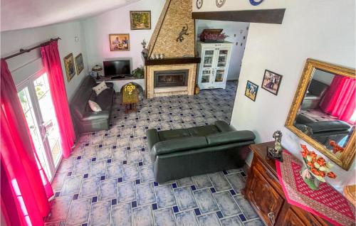 a living room with a couch and a fireplace at Awesome Home In Las Terreras, Lorca in Las Lomas de Lastón