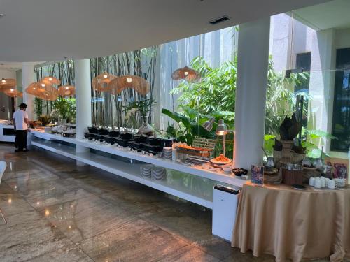 a buffet line with an aquarium in a building at ReLuxe マリン Condo in Maribago