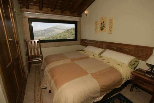 Posteľ alebo postele v izbe v ubytovaní Apartamento Rural El Labrador es un cómodo y acogedor apartamento