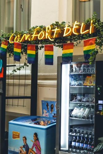 a store with a rainbow delight sign and a drink stand at Comfort Hotel Malmö in Malmö