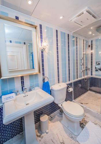 a bathroom with a toilet and a sink at Hotel Madera Hollywood in Hong Kong