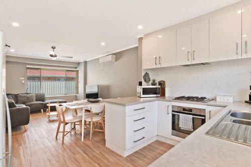 A kitchen or kitchenette at West Beach Family Beauty - 2 Bed Unit
