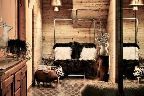 Ένα ή περισσότερα κρεβάτια σε δωμάτιο στο Boutique Hotel e Chalets Salvadori