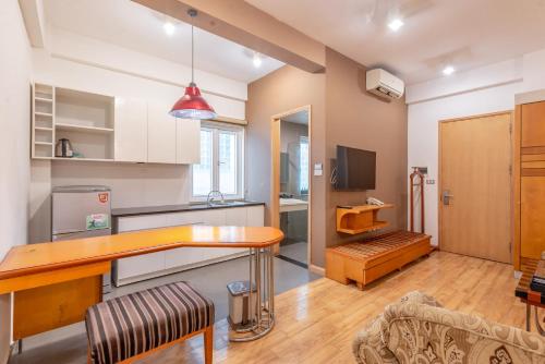 a kitchen with a wooden counter top in a room at Hanoi Golden Sunshine Villa Hotel and Travel in Hanoi