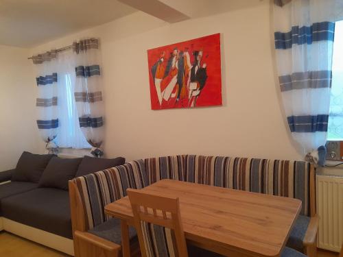 a living room with a couch and a table at Appartment für 4 bis 8 Personen in Bad Zell