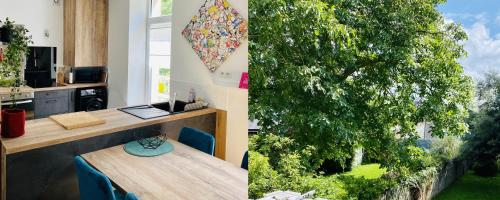 zwei Bilder eines Baumes in einem Zimmer mit einem Tisch in der Unterkunft CLINT HOUSE - Appartement "l'Île aux Moines" in Perros-Guirec