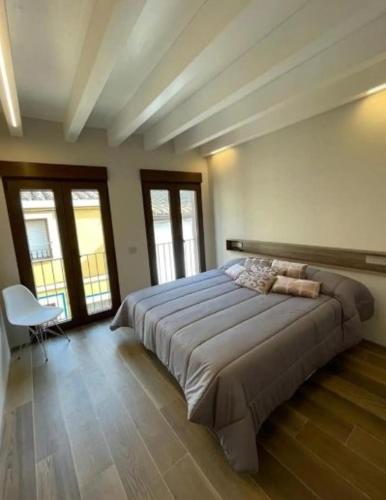 a bedroom with a large bed in a room at Casa Rural L'Alba in Catí