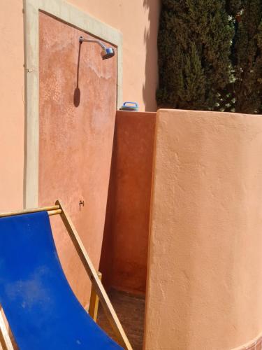 a blue slide in front of a door at Villa Al Kharoube in Essaouira