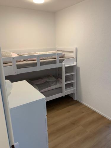 a small room with two bunk beds in it at Black Forest in Herrischried