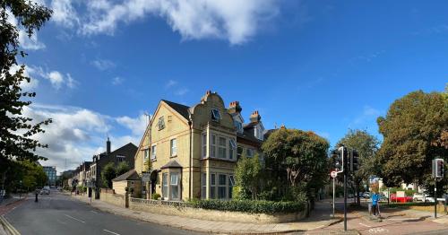 a house on the corner of a city street at A & B Guest House Cambridge Ltd in Cambridge