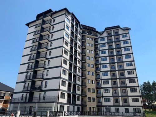 a tall apartment building in a city at Zlatiborska bajka in Zlatibor